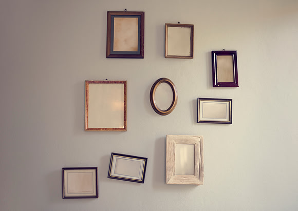 Blank Empty Photo Frames Hanging on the Wall